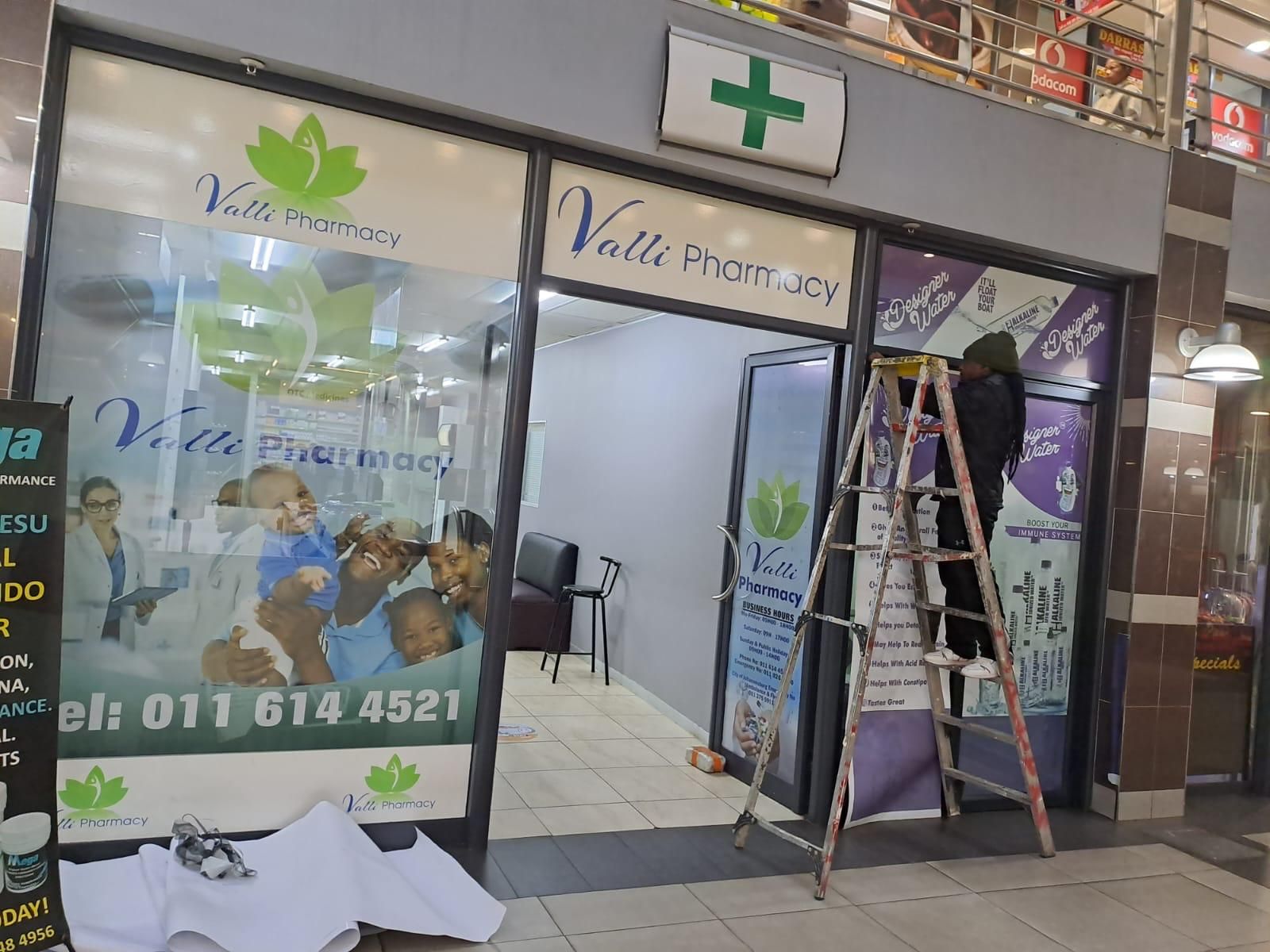 Valti Pharmacy shopfront with new window graphics and signage
